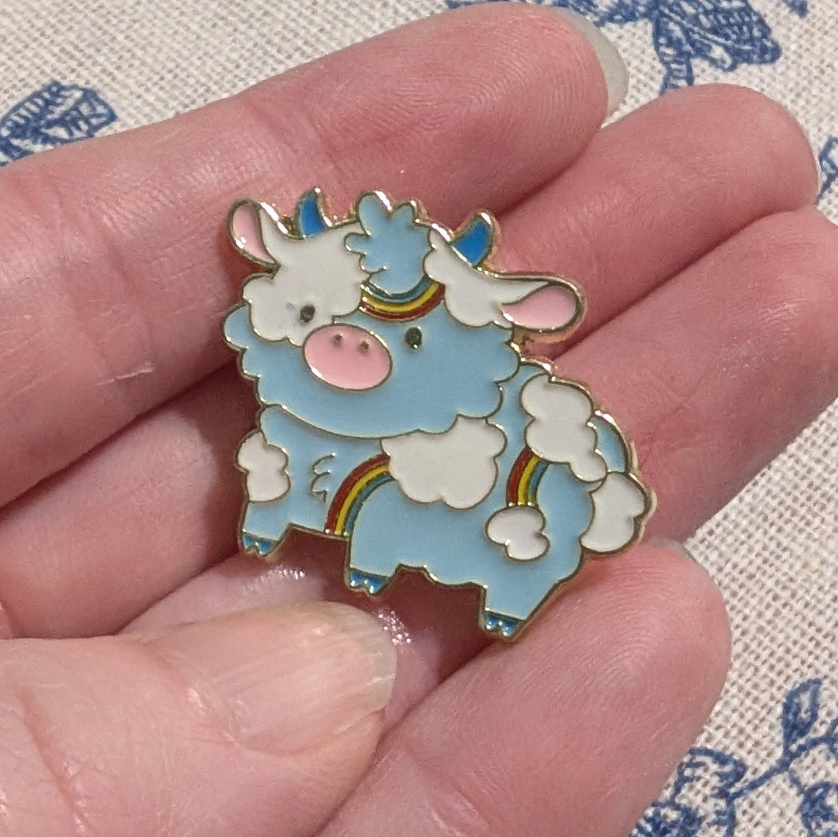 Blue Skies with Rainbows Cow Enamel Pin