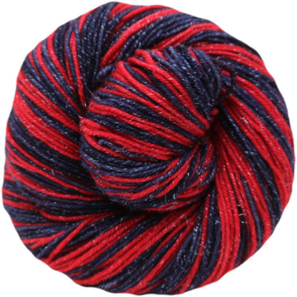 Red and navy yarn ball on a white background