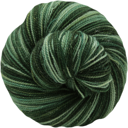 A skein of self striping yarn in shades of forest green, olive green, and dark teal, photographed on a solid white background.