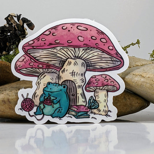 Mimic Gaming Co - Frog Knitting Under Mushroom Cap Sticker - 2.5"